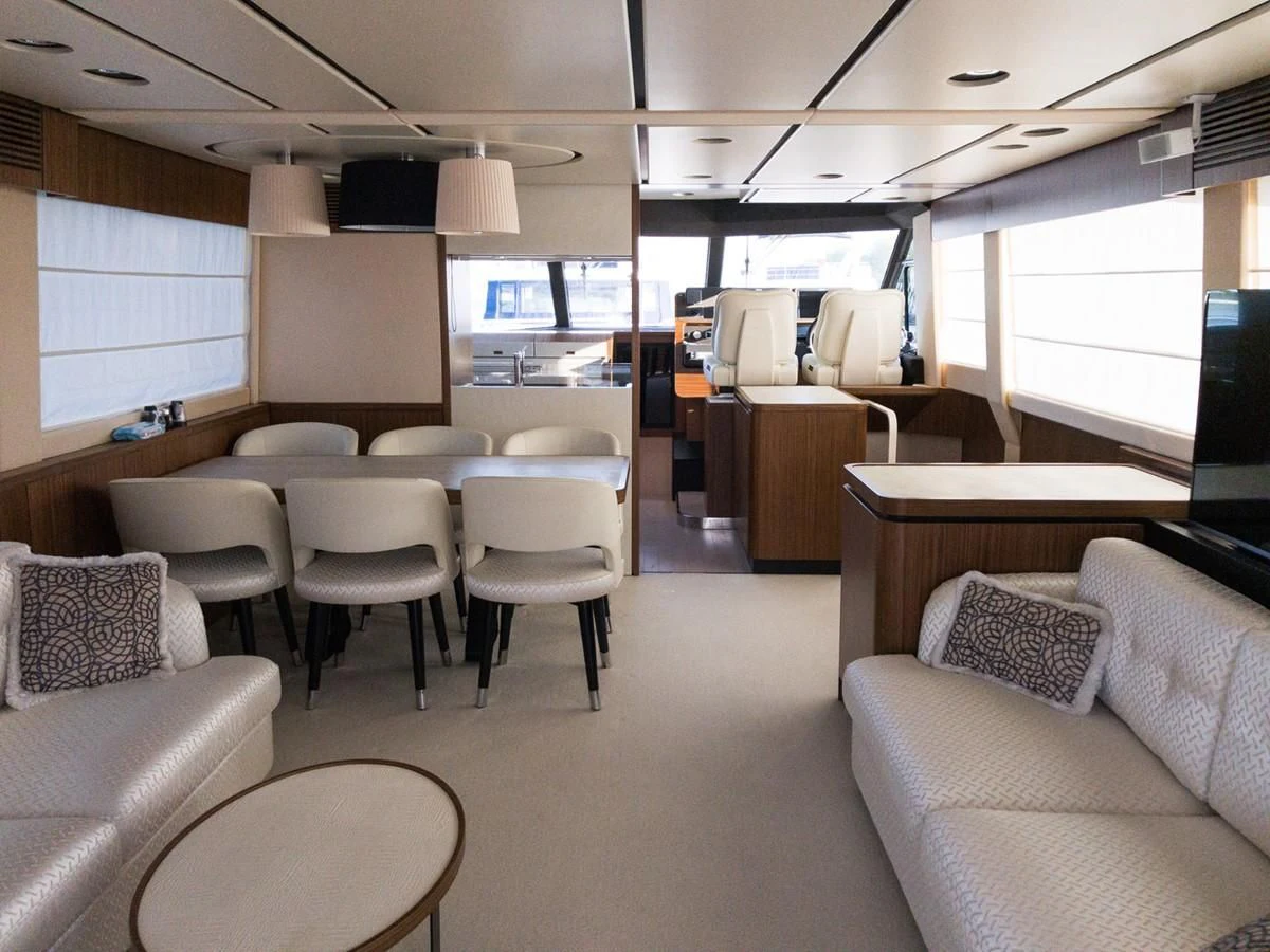a room with chairs and tables aboard MAGELLANO 66 Yacht for Sale