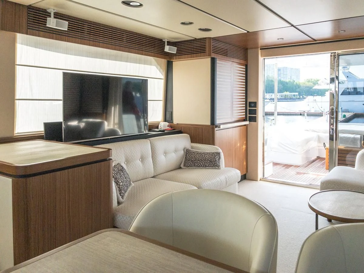 a living room with a large window aboard MAGELLANO 66 Yacht for Sale