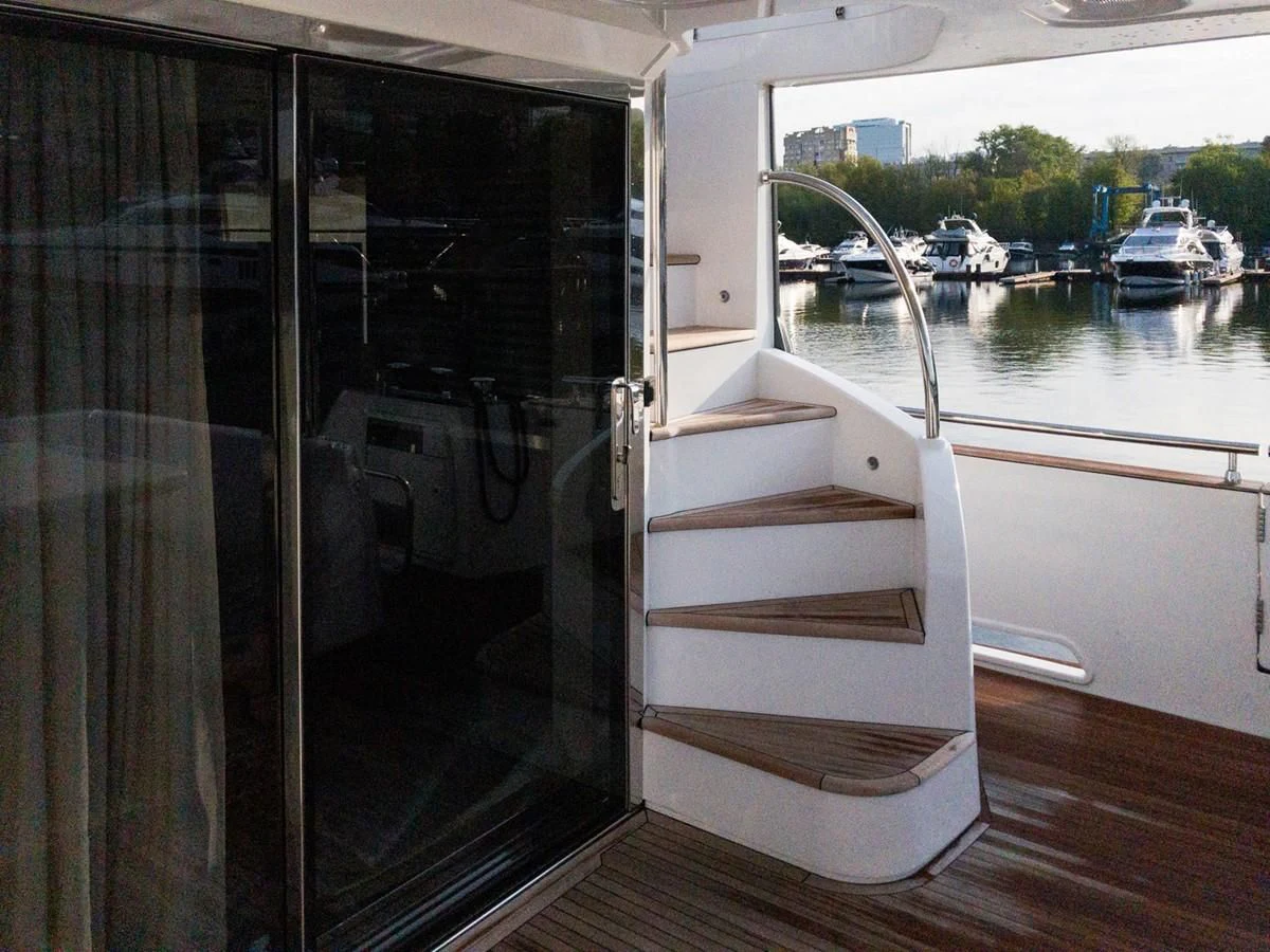 a large white door with a handle aboard MAGELLANO 66 Yacht for Sale