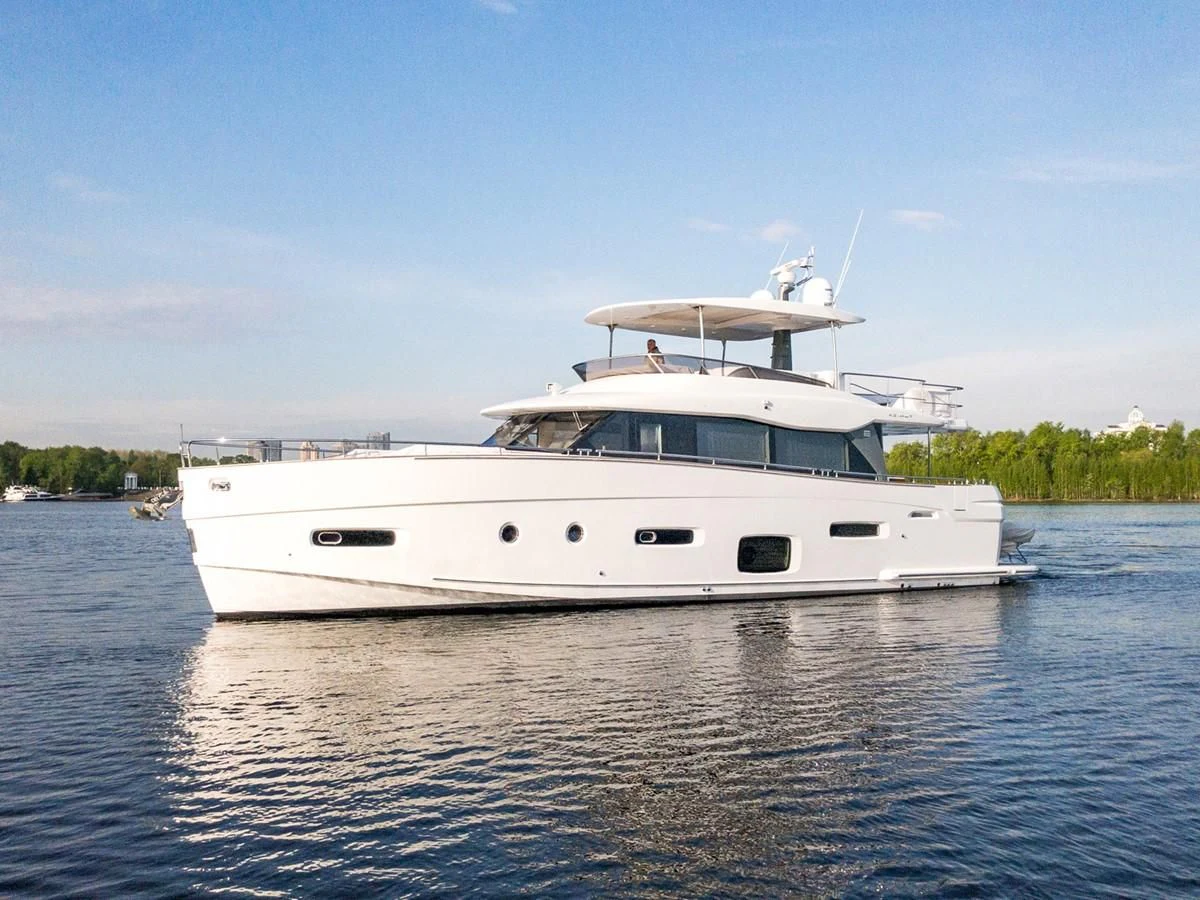 a white boat on the water aboard MAGELLANO 66 Yacht for Sale