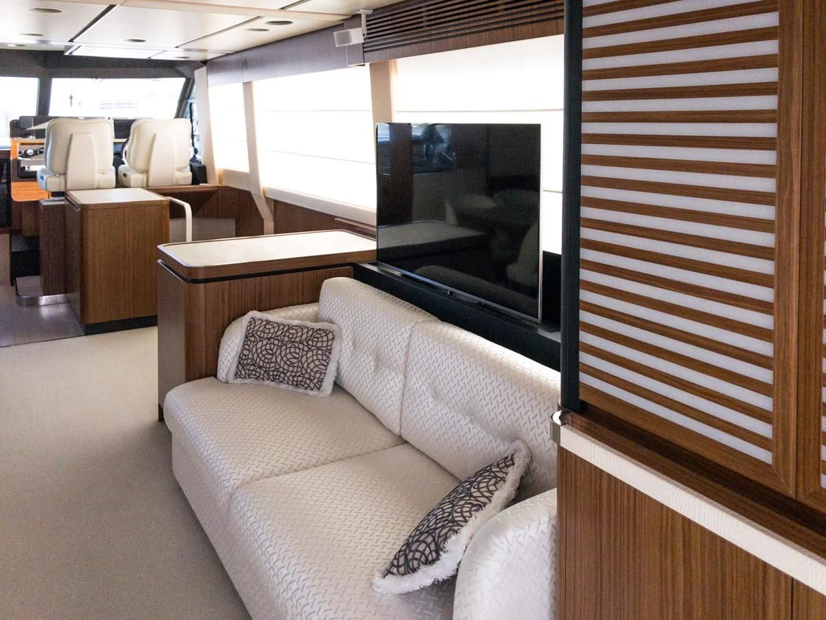 a couch in a room aboard MAGELLANO 66 Yacht for Sale