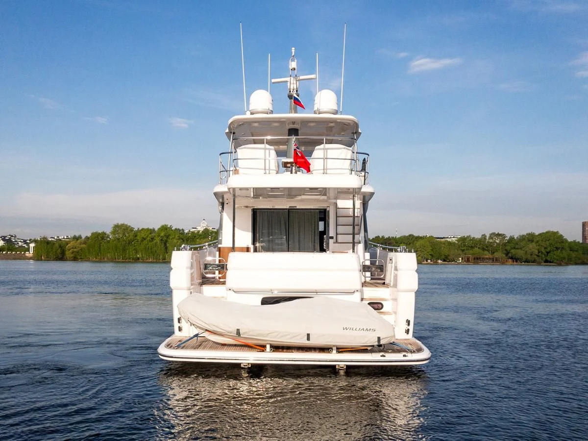 a white boat on the water aboard MAGELLANO 66 Yacht for Sale