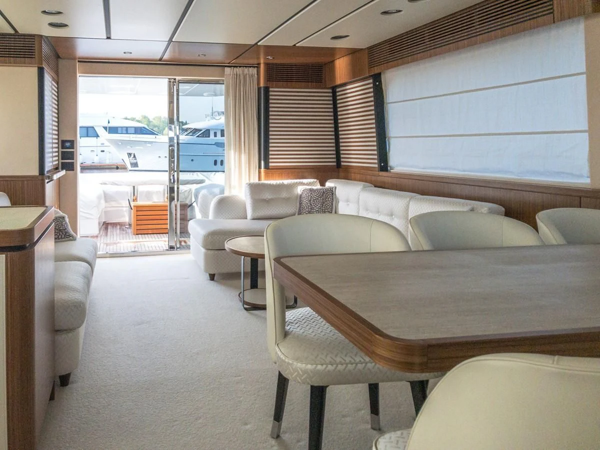 a living room with a couch and a table aboard MAGELLANO 66 Yacht for Sale