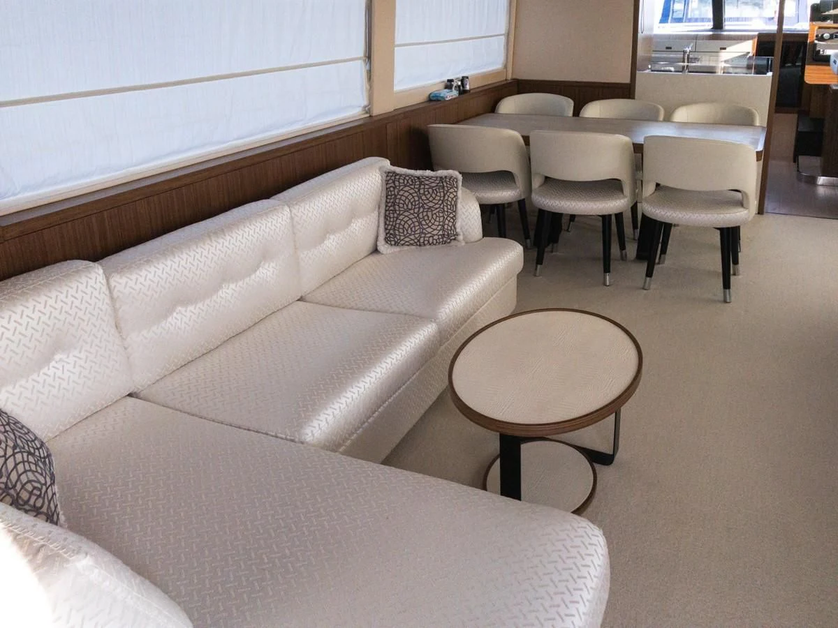 a room with couches and tables aboard MAGELLANO 66 Yacht for Sale