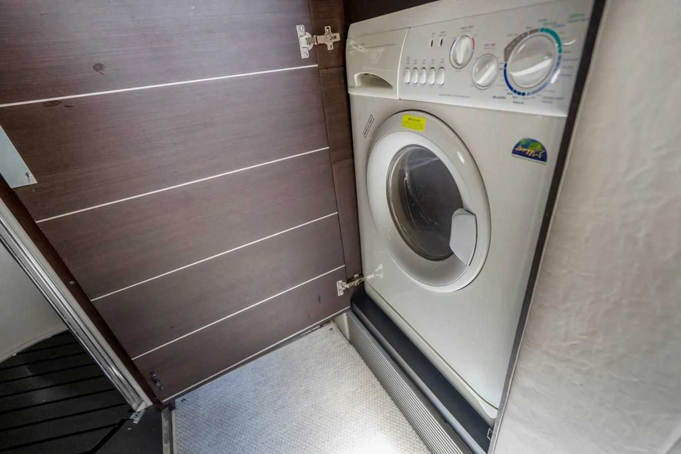 a white washing machine aboard KNOTORIOUS IV Yacht for Sale
