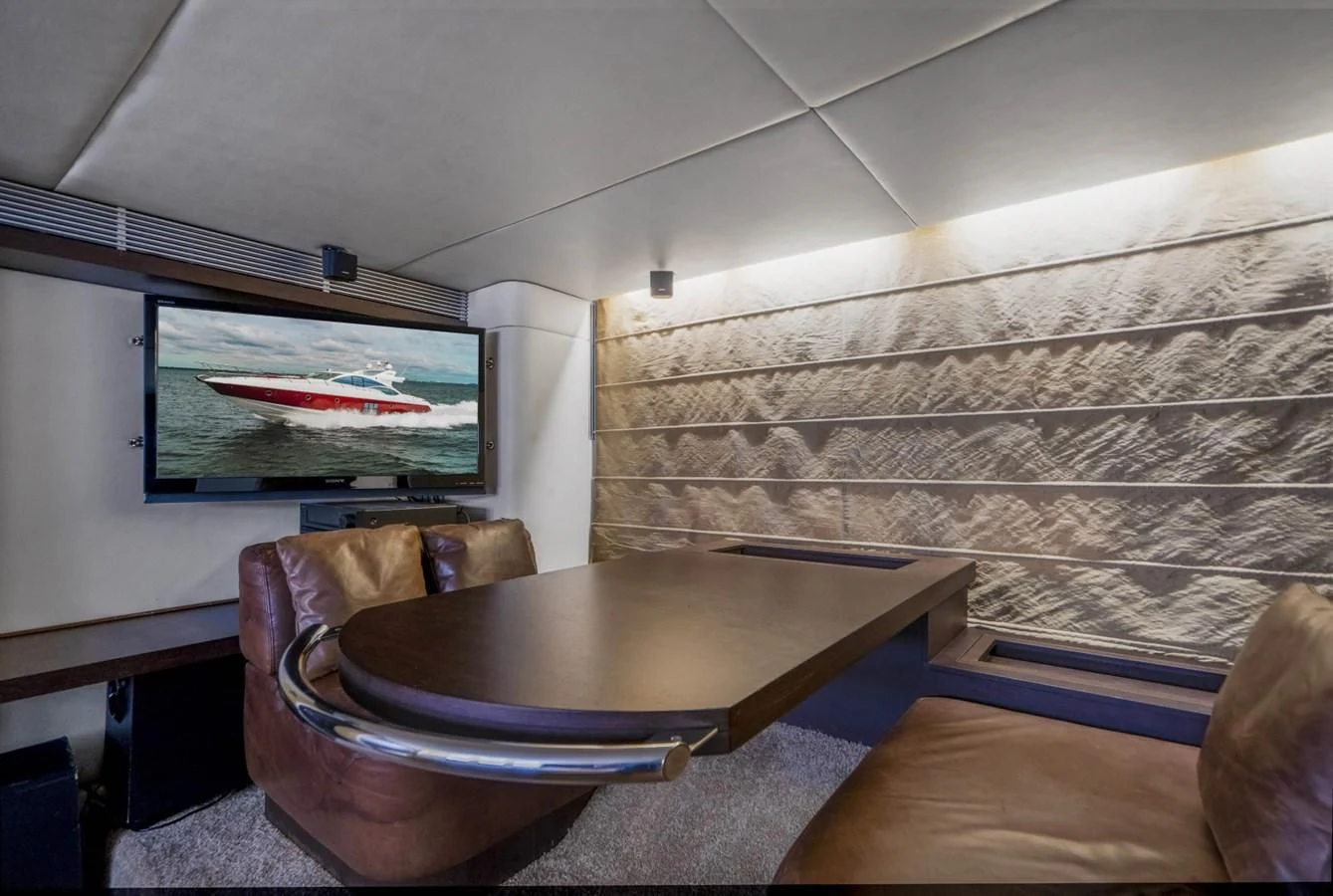 a room with a table and chairs aboard KNOTORIOUS IV Yacht for Sale
