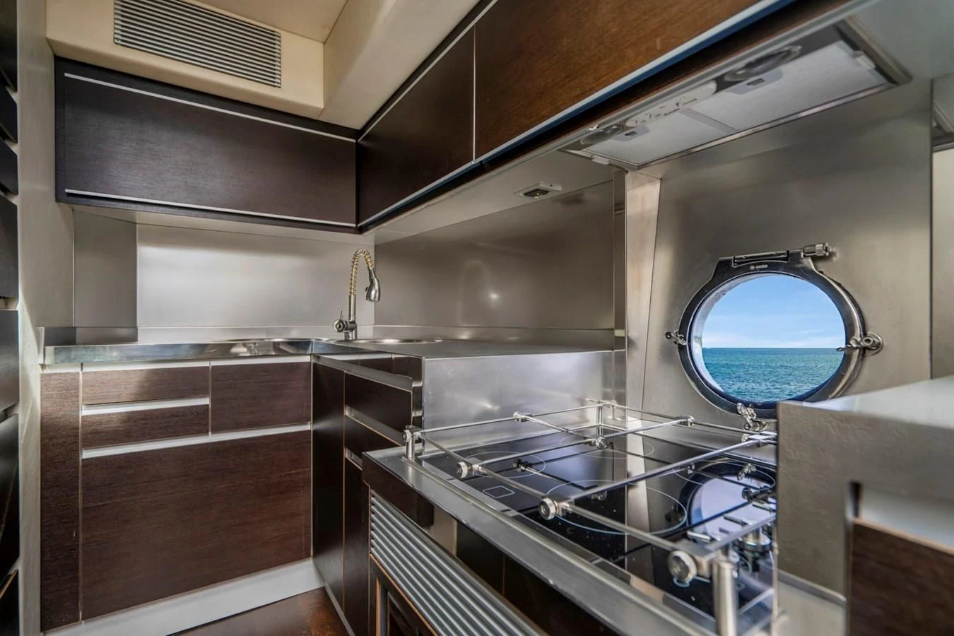 a kitchen with a large window aboard KNOTORIOUS IV Yacht for Sale