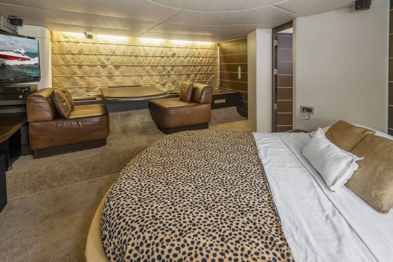 a hotel room with a bed and a tv aboard KNOTORIOUS IV Yacht for Sale