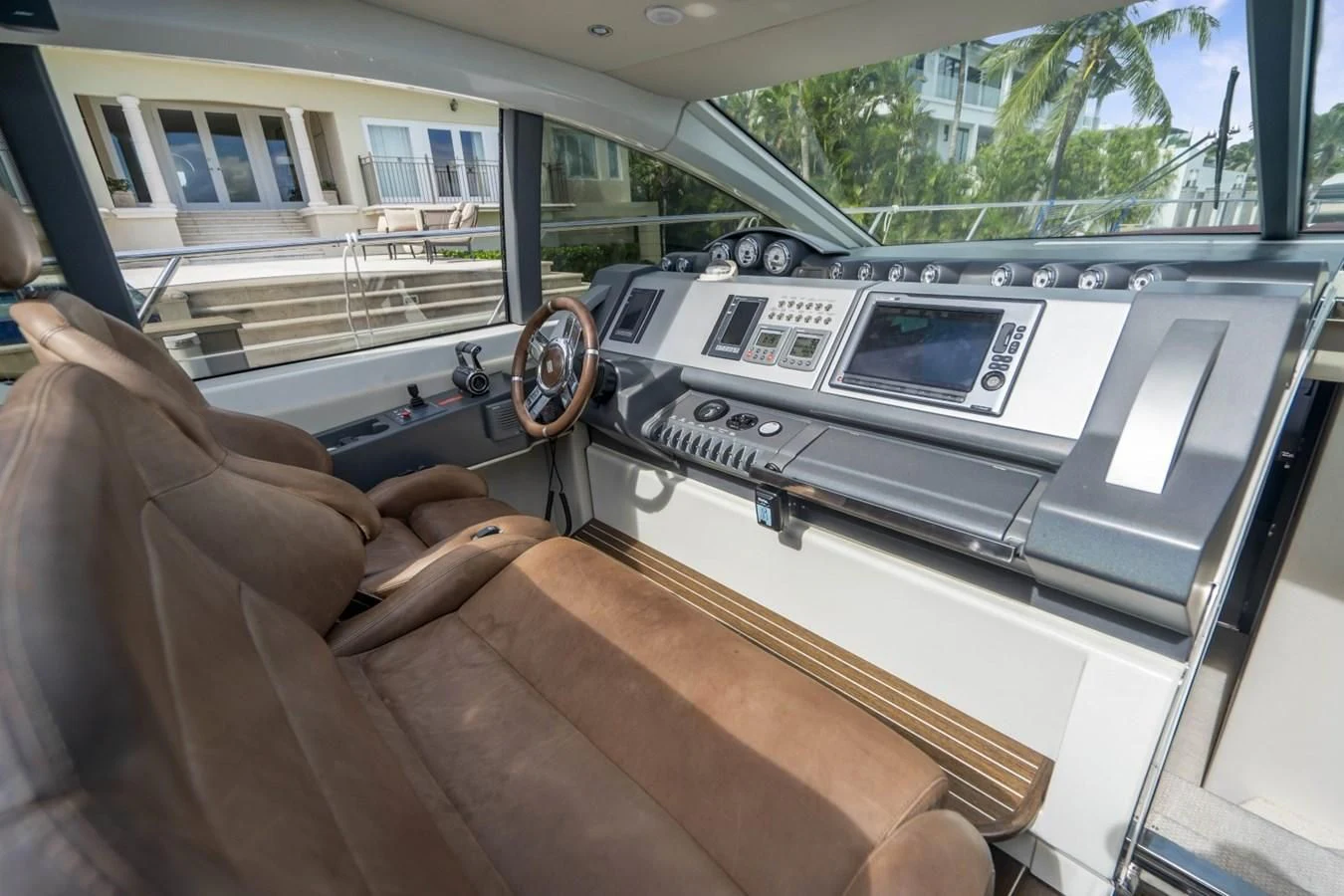 a person's legs on a couch in a car aboard KNOTORIOUS IV Yacht for Sale