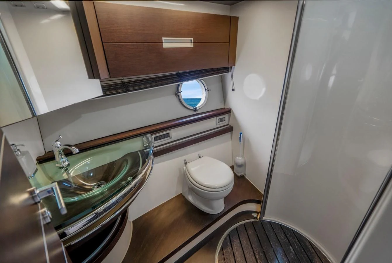 a bathroom with a sink and a toilet aboard KNOTORIOUS IV Yacht for Sale