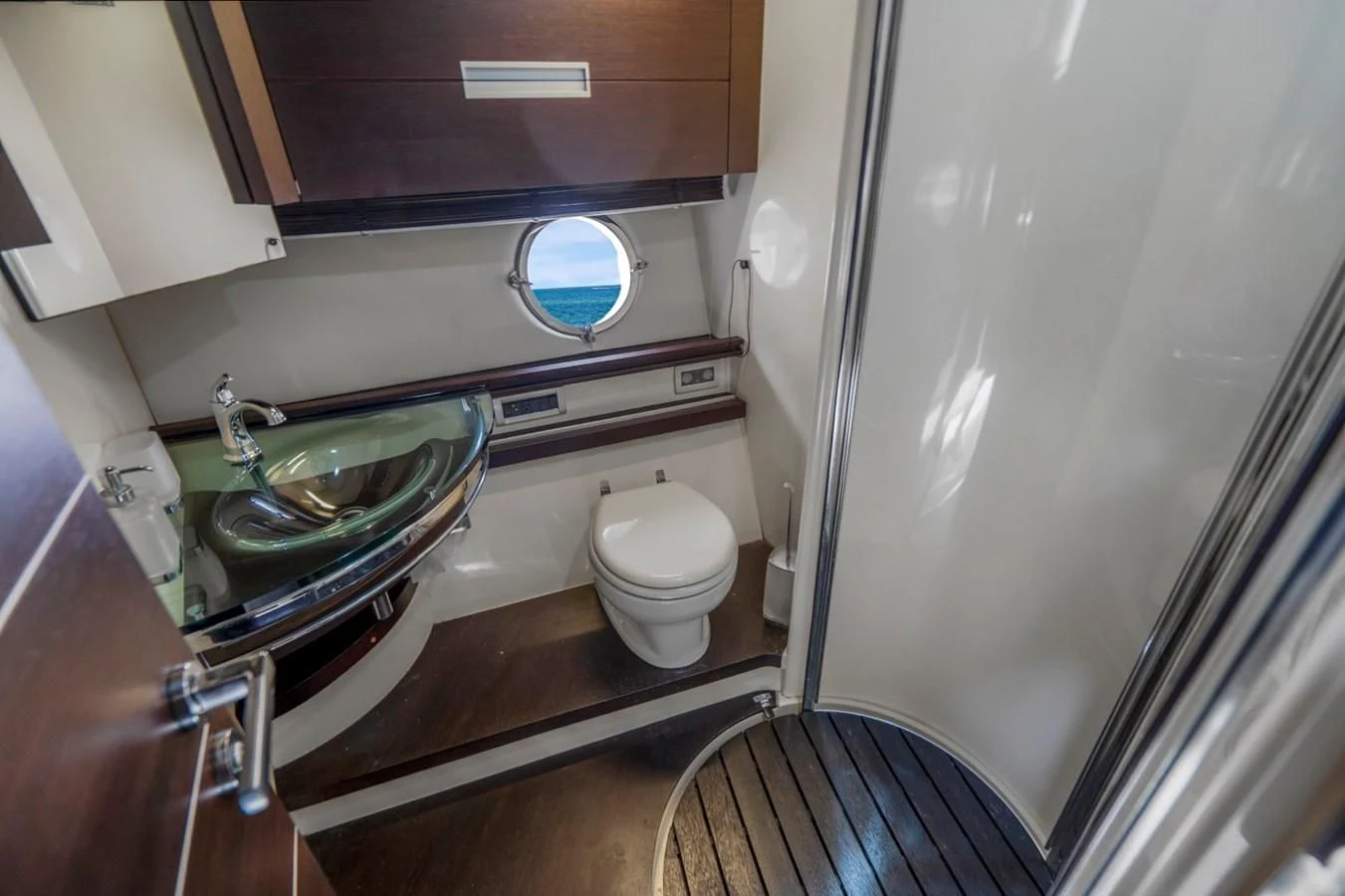a bathroom with a sink and a toilet aboard KNOTORIOUS IV Yacht for Sale