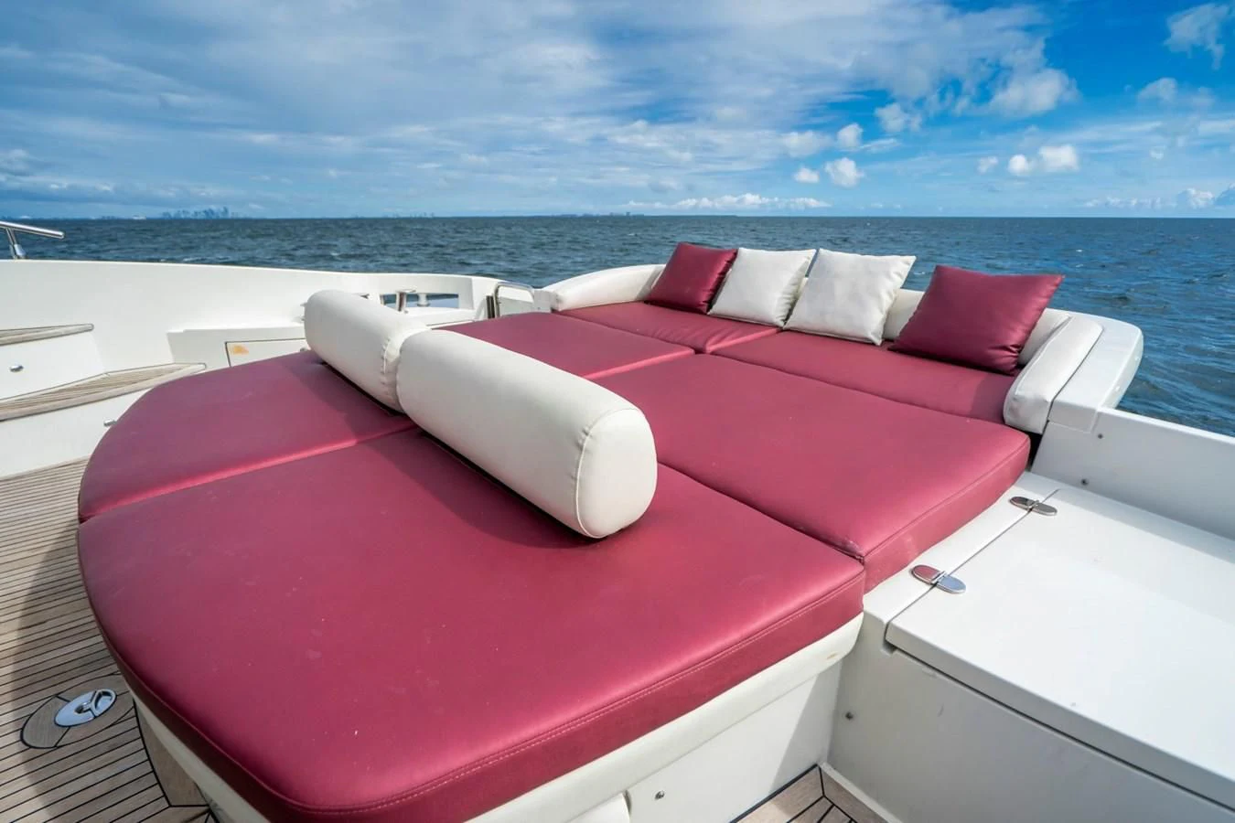 a red convertible car with pillows aboard KNOTORIOUS IV Yacht for Sale