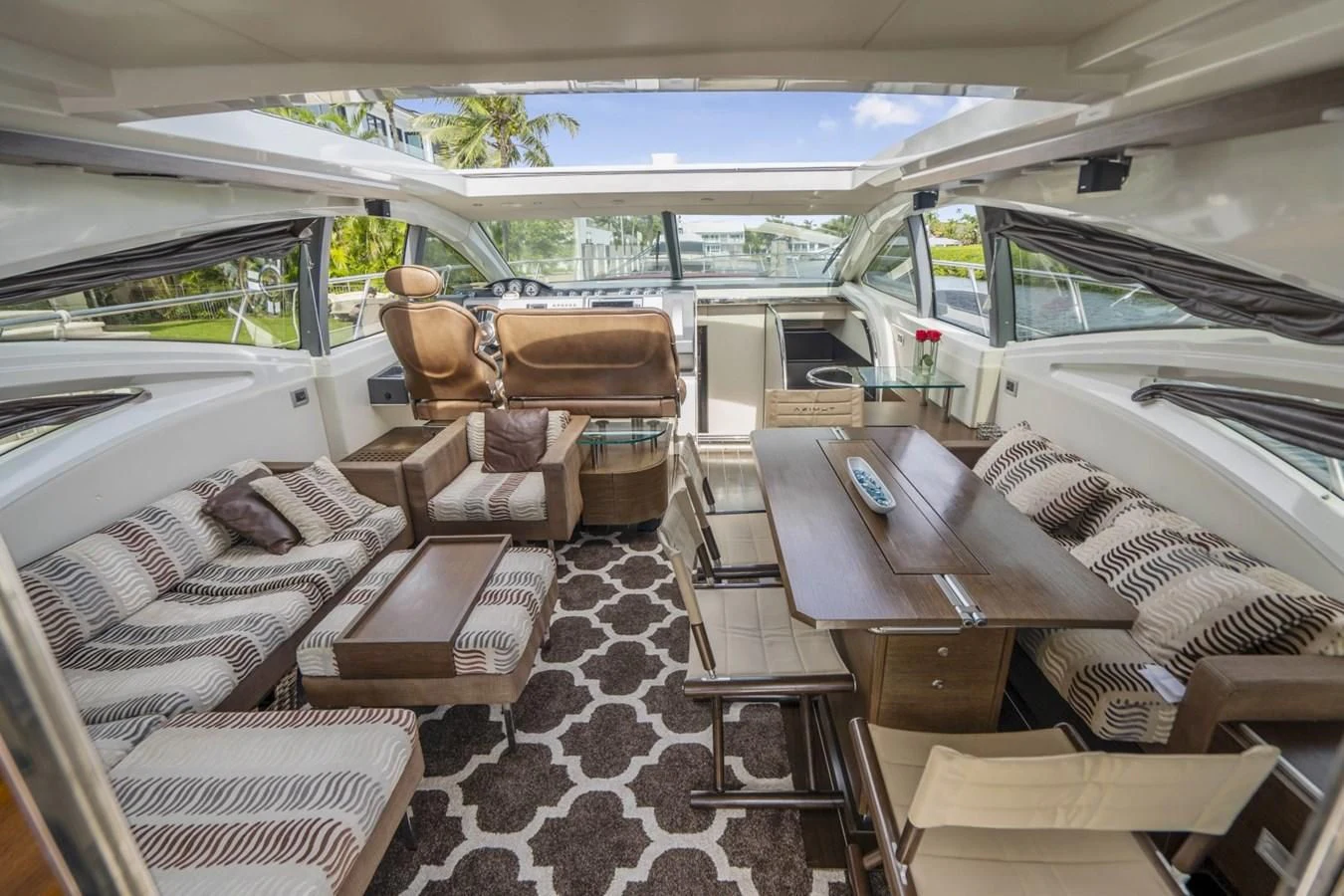 inside of a tent with a table and chairs aboard KNOTORIOUS IV Yacht for Sale