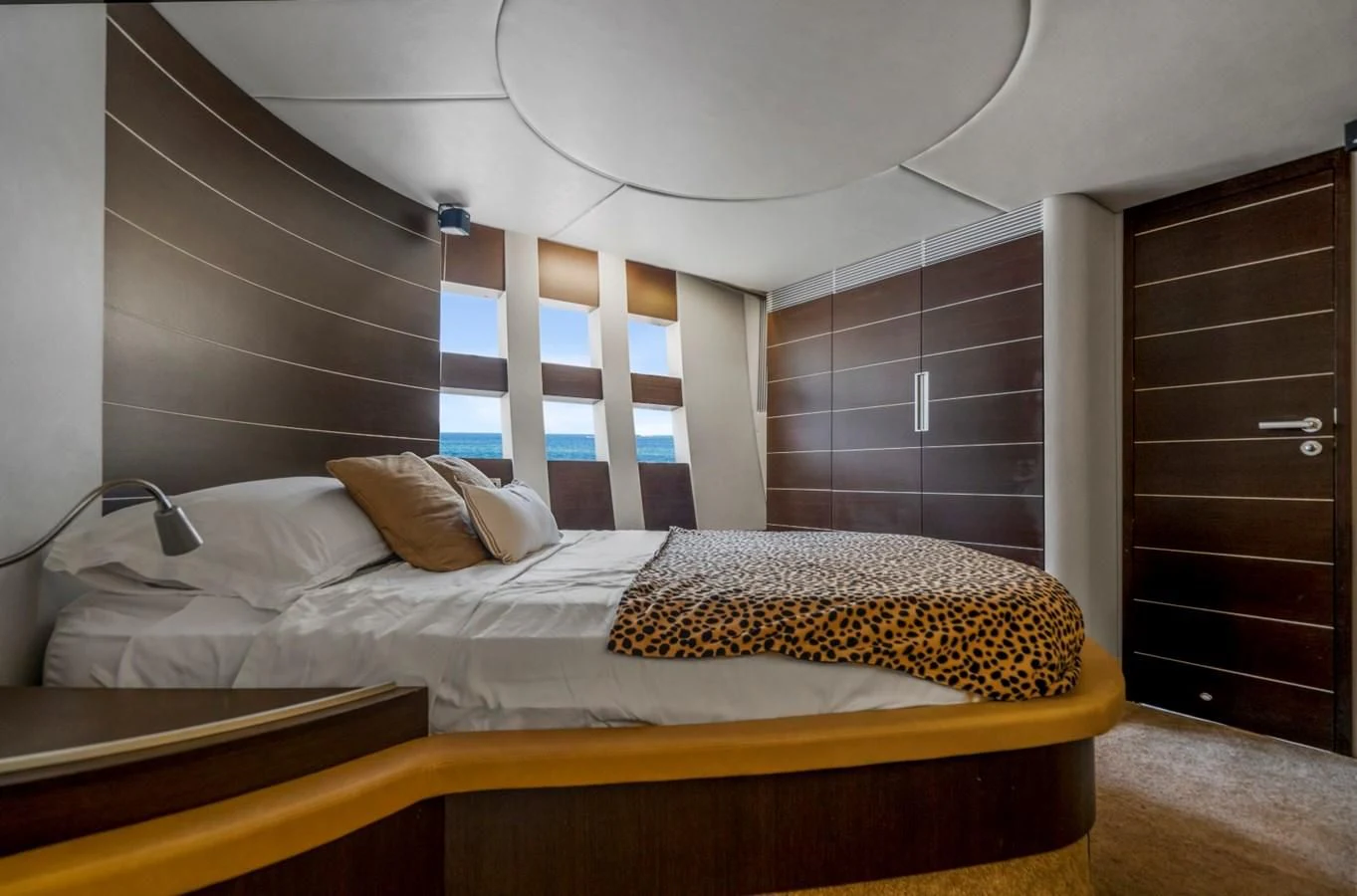 a bed with a white ceiling aboard KNOTORIOUS IV Yacht for Sale