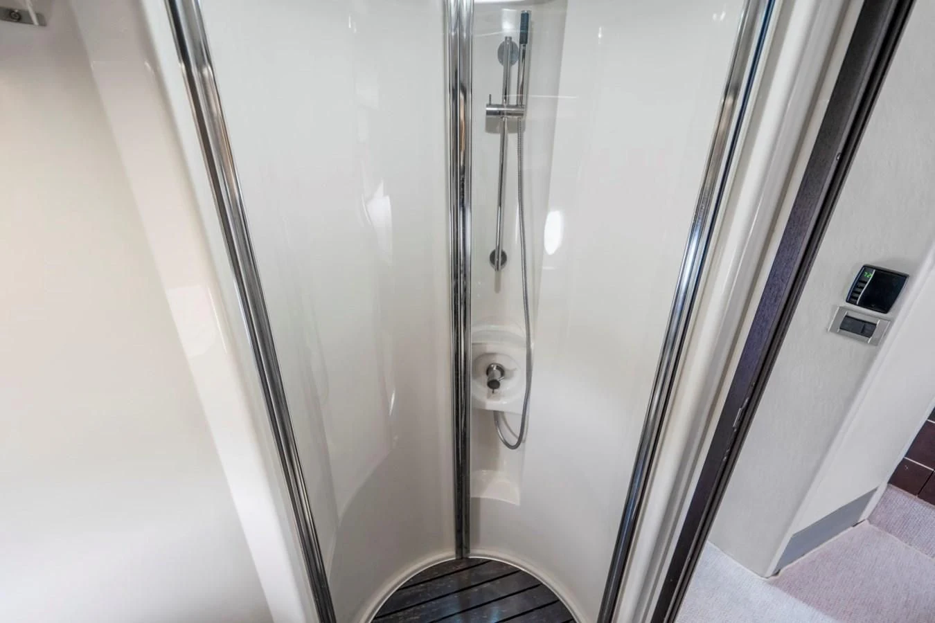 a white door with a handle aboard KNOTORIOUS IV Yacht for Sale