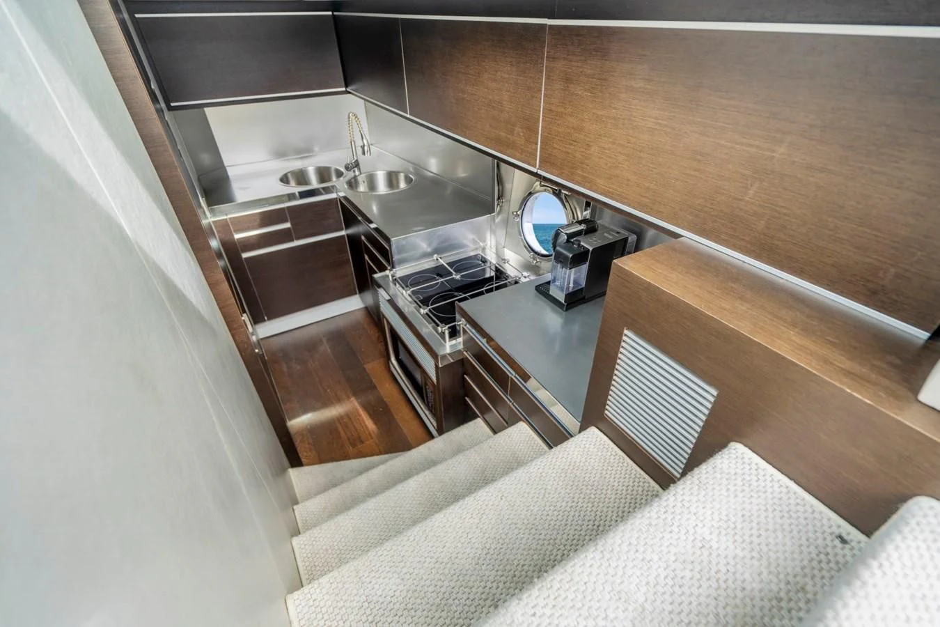a kitchen with a sink and a stove aboard KNOTORIOUS IV Yacht for Sale