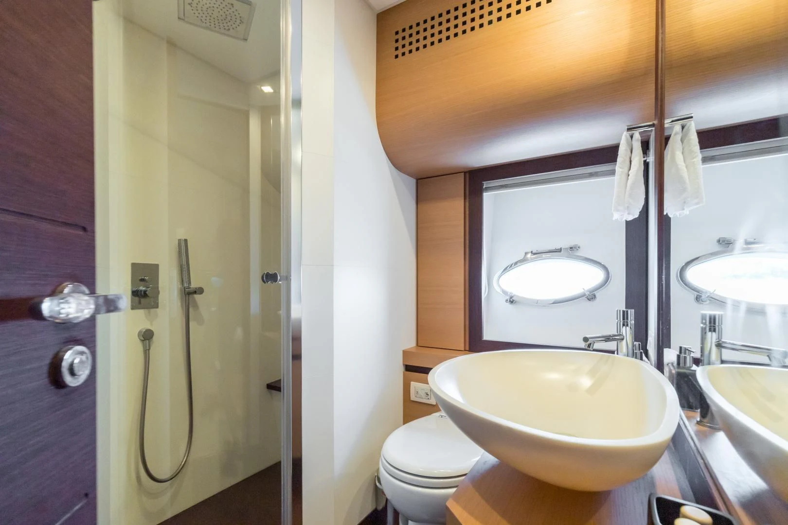 a bathroom with a sink and toilet aboard LOONEY Yacht for Sale