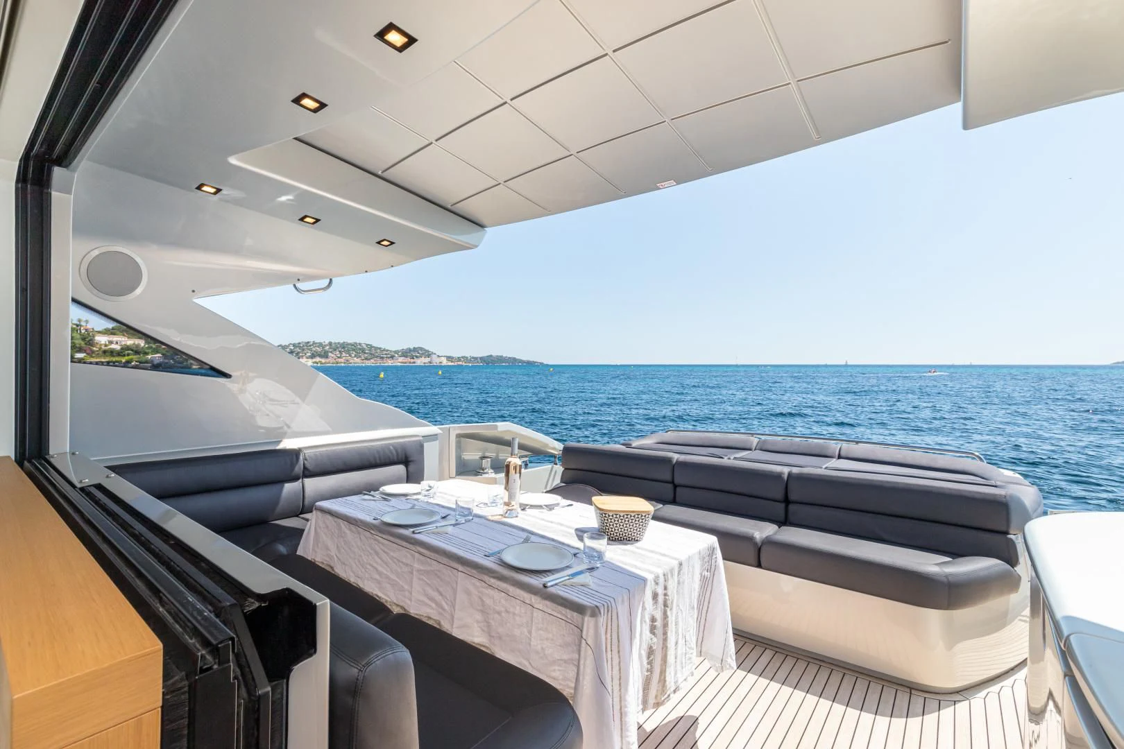 a room with a table and chairs aboard LOONEY Yacht for Sale