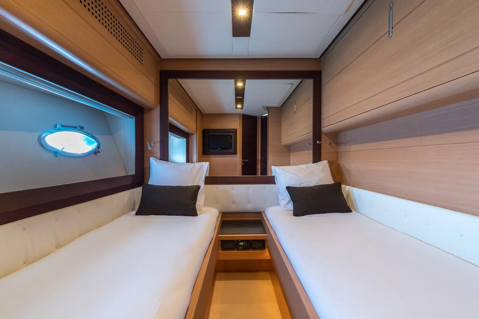 a room with a bed and a television aboard LOONEY Yacht for Sale