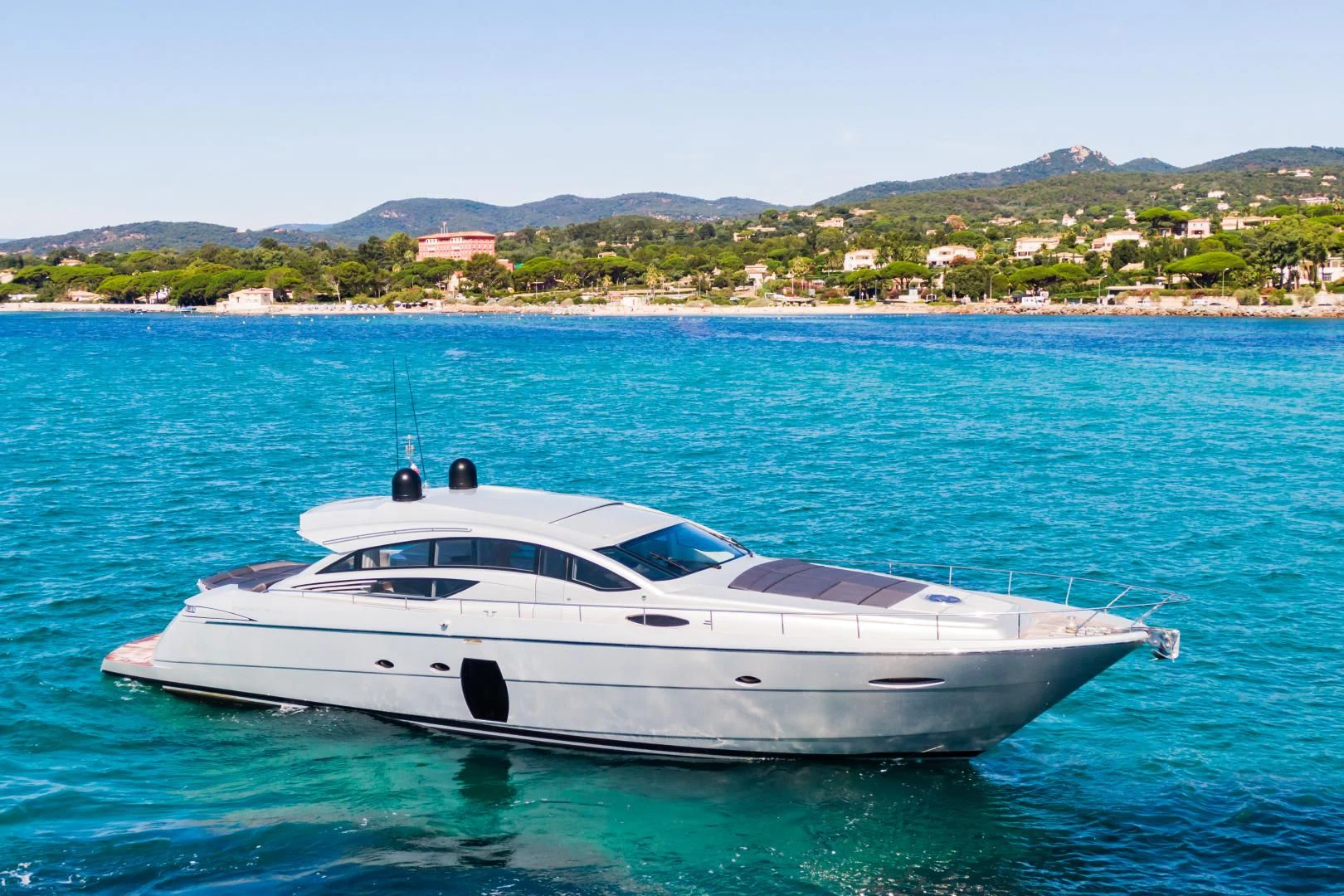 a white yacht in the water aboard LOONEY Yacht for Sale