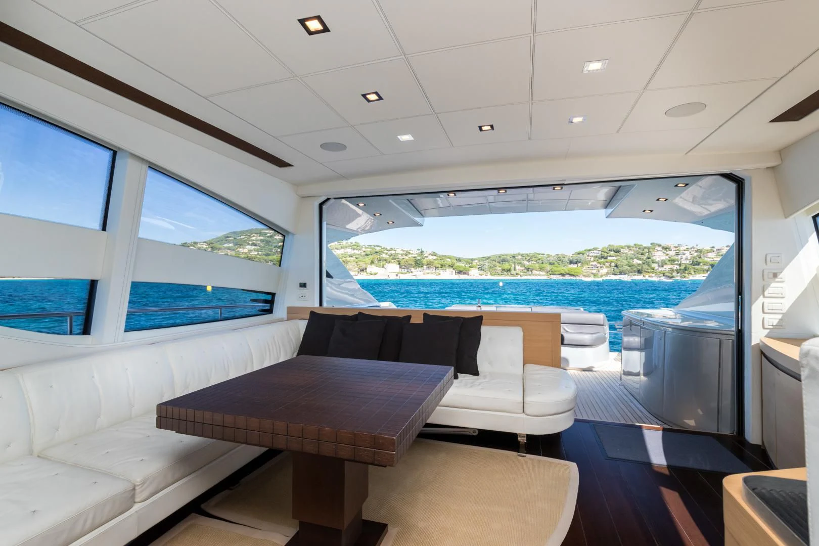 a room with a table and chairs aboard LOONEY Yacht for Sale
