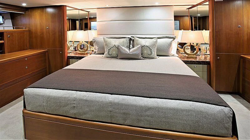 a large bed with white sheets aboard BELLE VIE Yacht for Sale