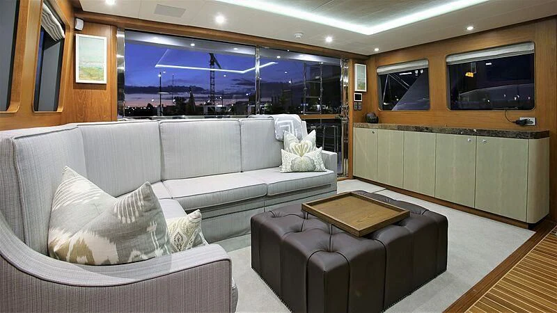 a living room with a couch and a tv aboard BELLE VIE Yacht for Sale
