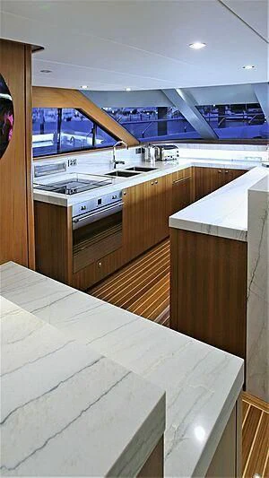 a kitchen with a large window aboard BELLE VIE Yacht for Sale