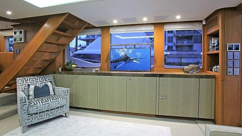 a room with a couch and a tv aboard BELLE VIE Yacht for Sale