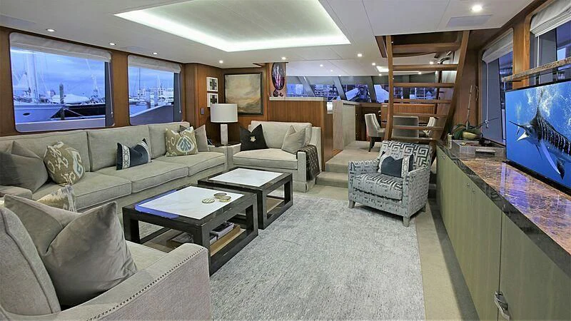 a living room with a large screen aboard BELLE VIE Yacht for Sale
