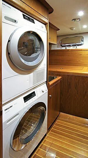 a washing machine in a room aboard BELLE VIE Yacht for Sale