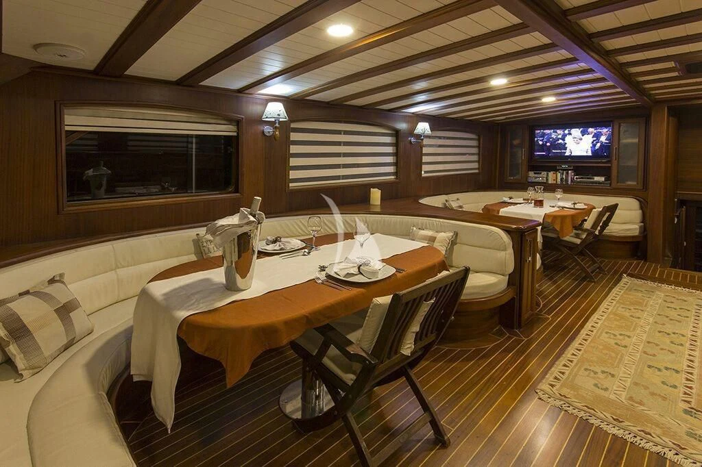 a room with a table and chairs aboard DREAMLAND Yacht for Sale