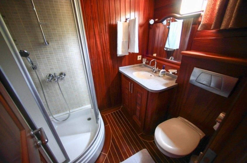a bathroom with a tub sink and toilet aboard DREAMLAND Yacht for Sale