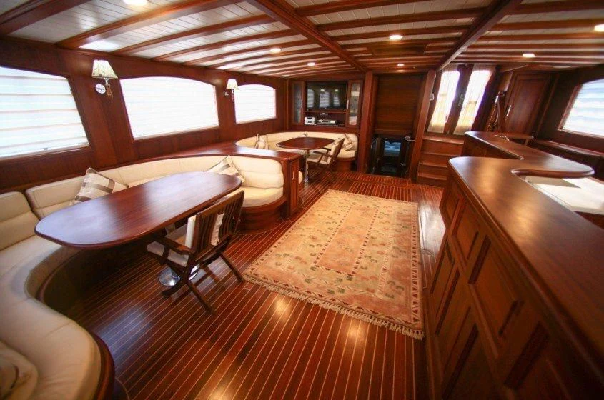 a room with a table and chairs aboard DREAMLAND Yacht for Sale