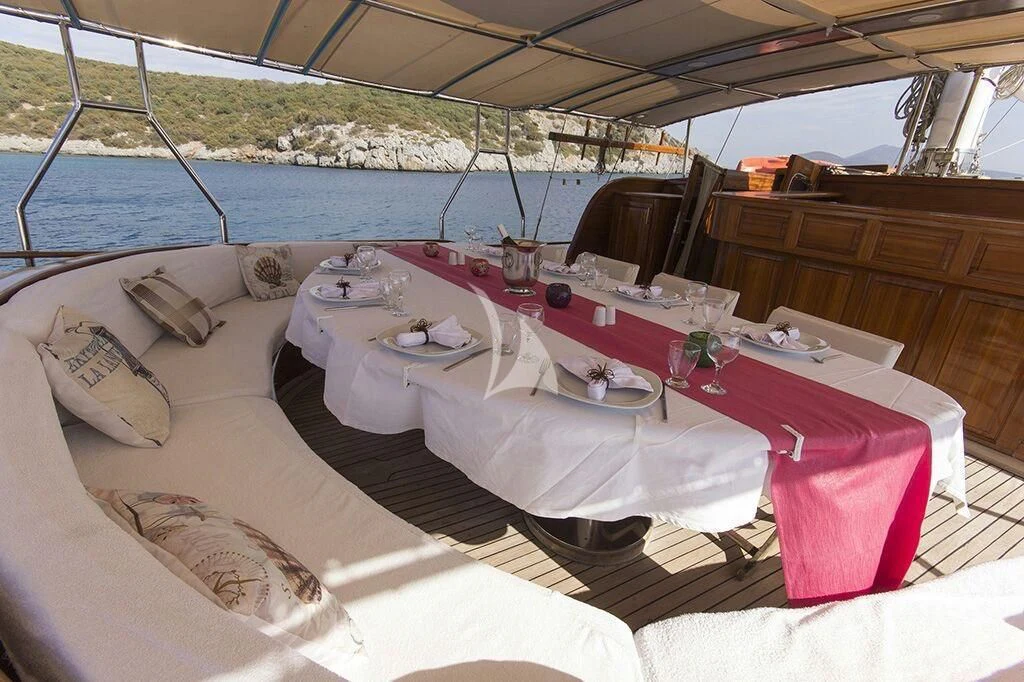 a table set for a dinner aboard DREAMLAND Yacht for Sale