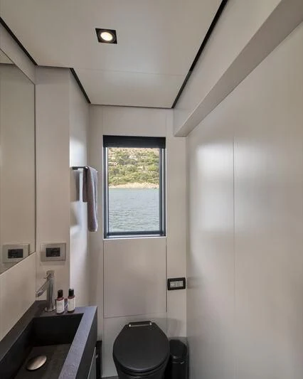 a bathroom with a toilet and a sink aboard TELL ME WHY Yacht for Sale