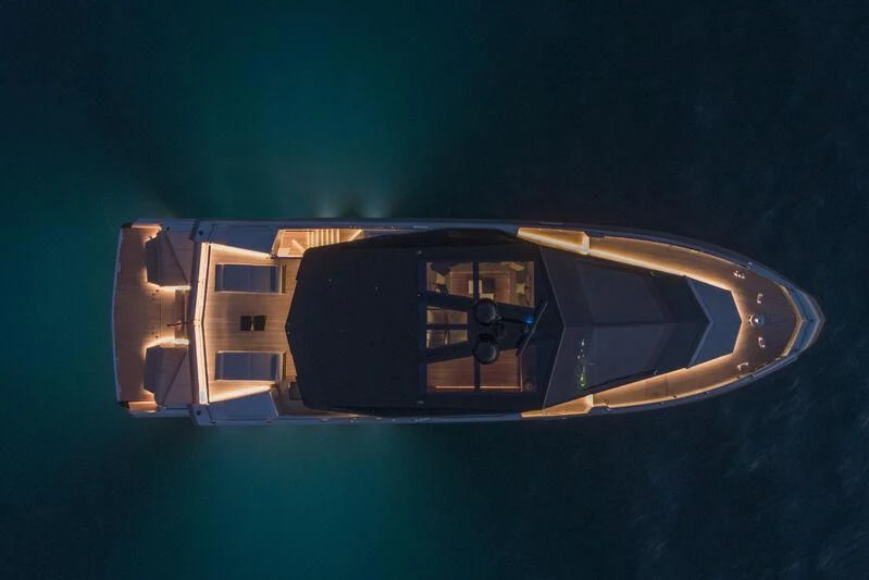 a reflection of a building in a round mirror aboard TELL ME WHY Yacht for Sale