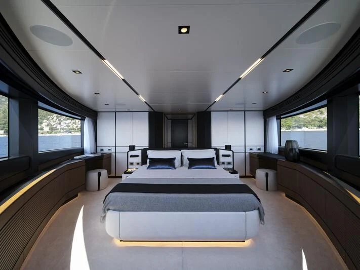 a large room with a bed and a couch aboard TELL ME WHY Yacht for Sale