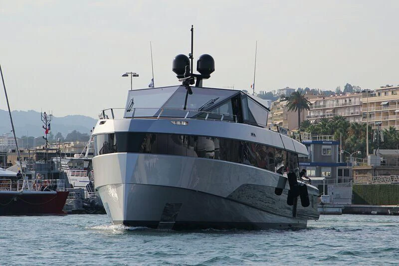 a couple of men standing on a boat in the water aboard TELL ME WHY Yacht for Sale
