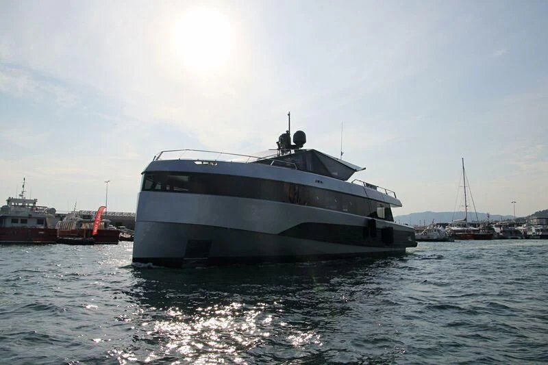 a large white boat in the water aboard TELL ME WHY Yacht for Sale