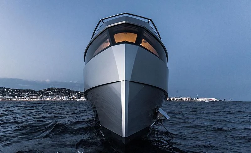 a large white and black space ship in the water aboard TELL ME WHY Yacht for Sale