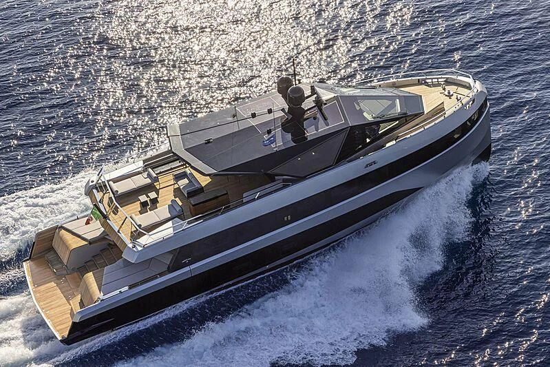 a boat on the water aboard TELL ME WHY Yacht for Sale
