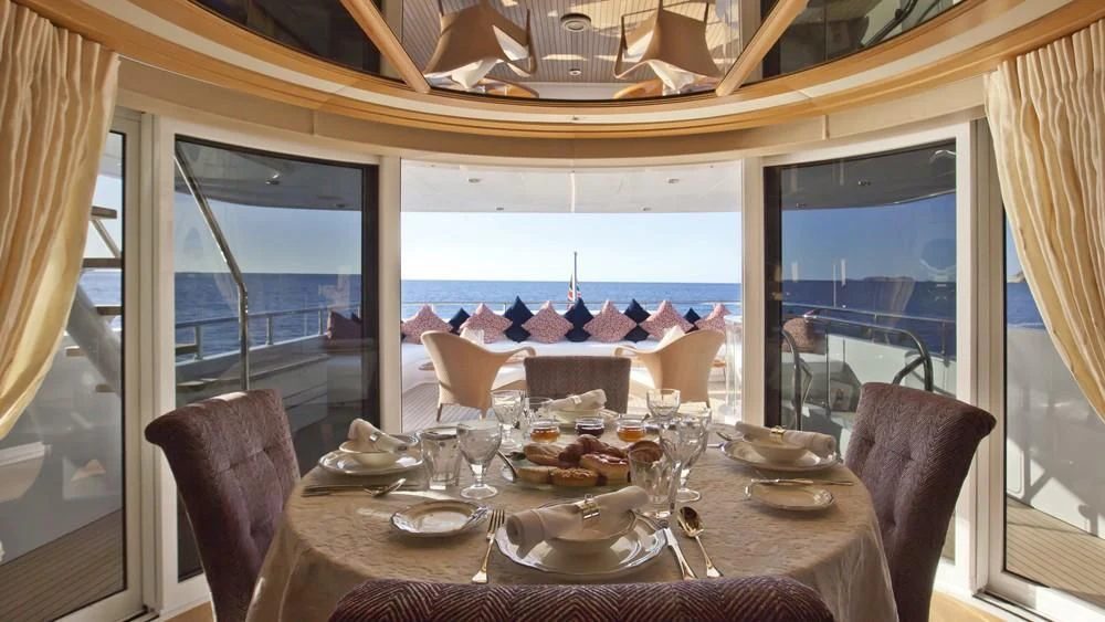 a dining table on a boat aboard BIG CHANGE II Yacht for Sale