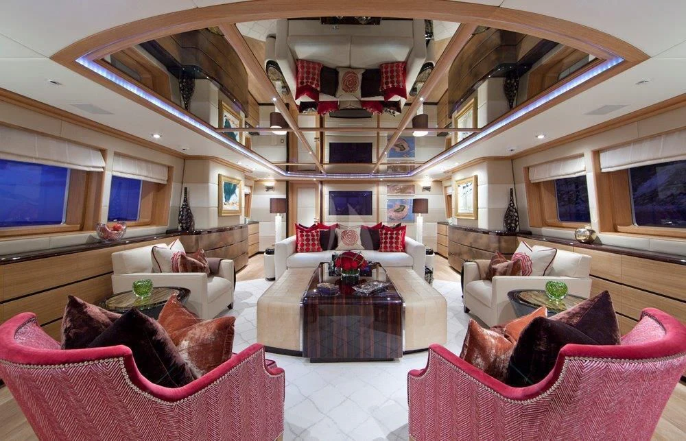 a living room with a large open ceiling aboard BIG CHANGE II Yacht for Sale