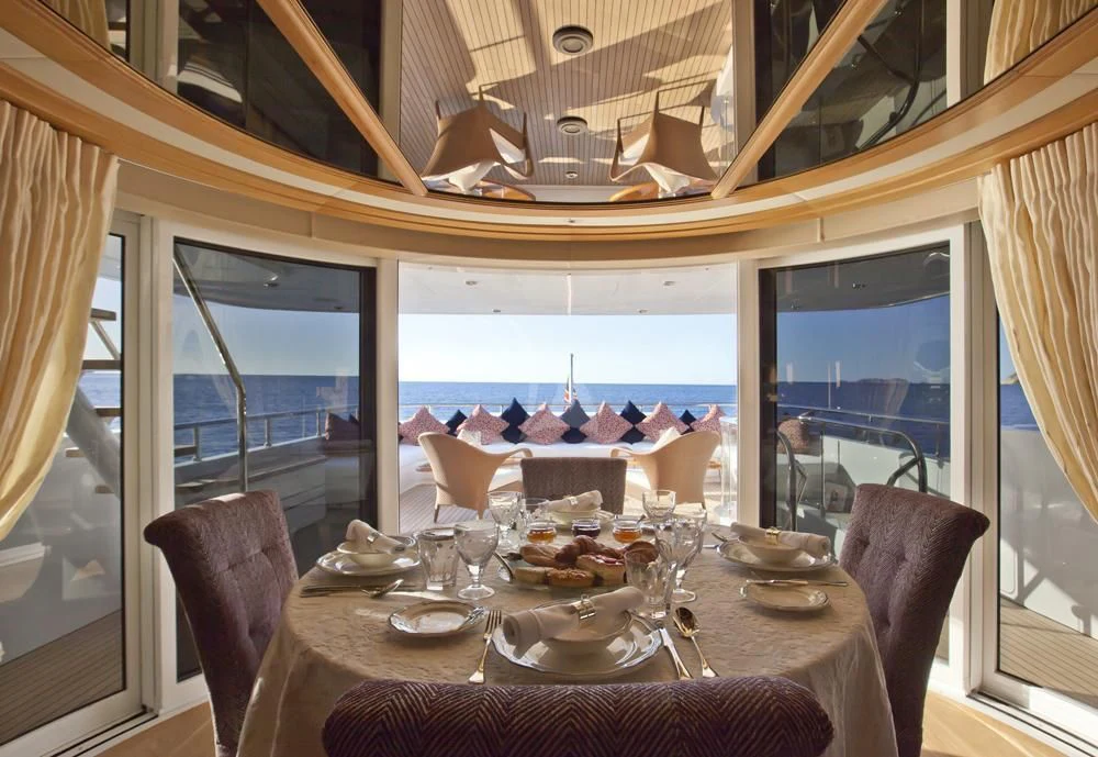 a dining table in a restaurant aboard BIG CHANGE II Yacht for Sale