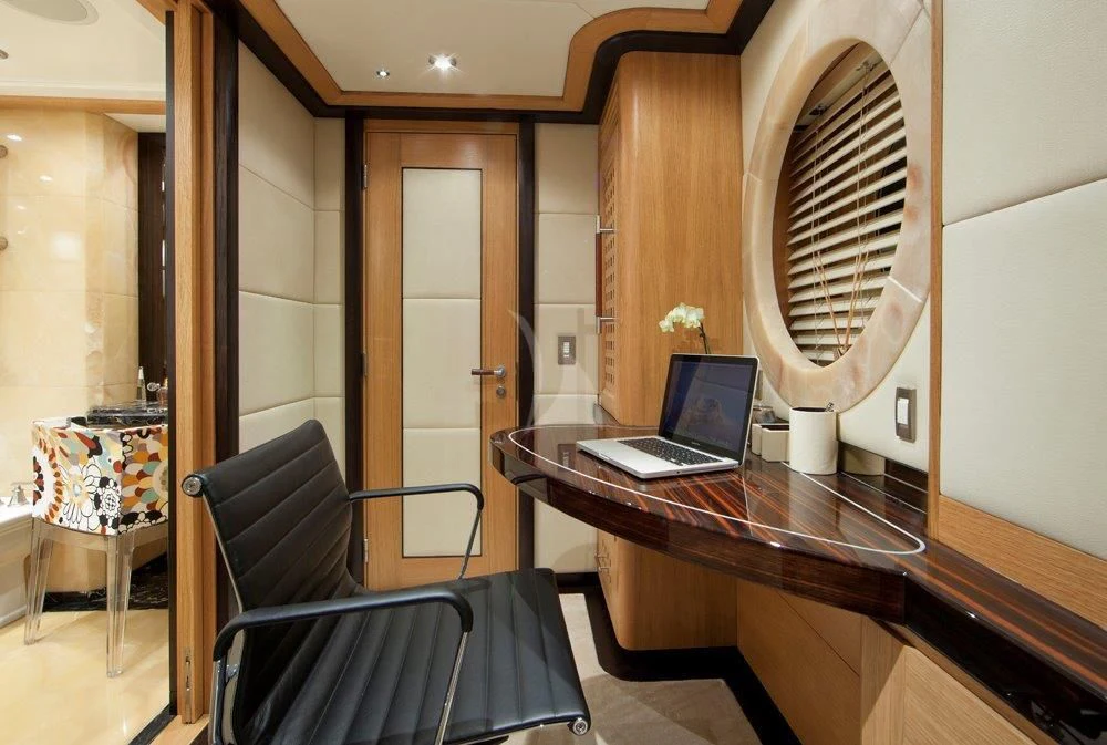 a laptop sits on a table aboard BIG CHANGE II Yacht for Sale