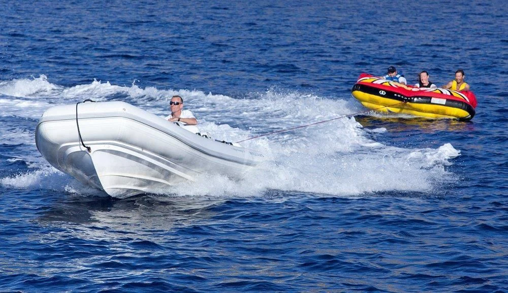 people in a speedboat aboard BIG CHANGE II Yacht for Sale