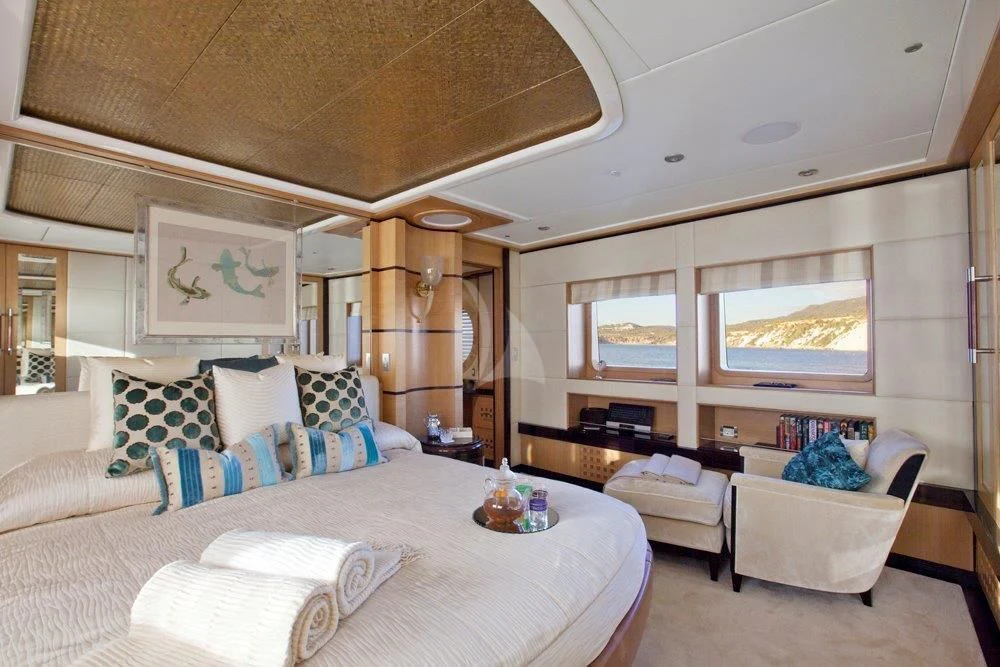 a large bedroom with a large bed aboard BIG CHANGE II Yacht for Sale