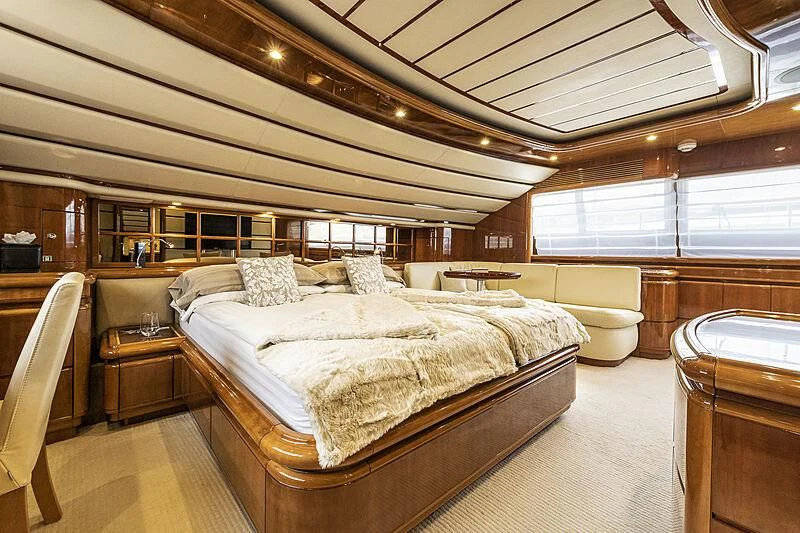 a large bedroom with a large bed aboard SETAI Yacht for Sale