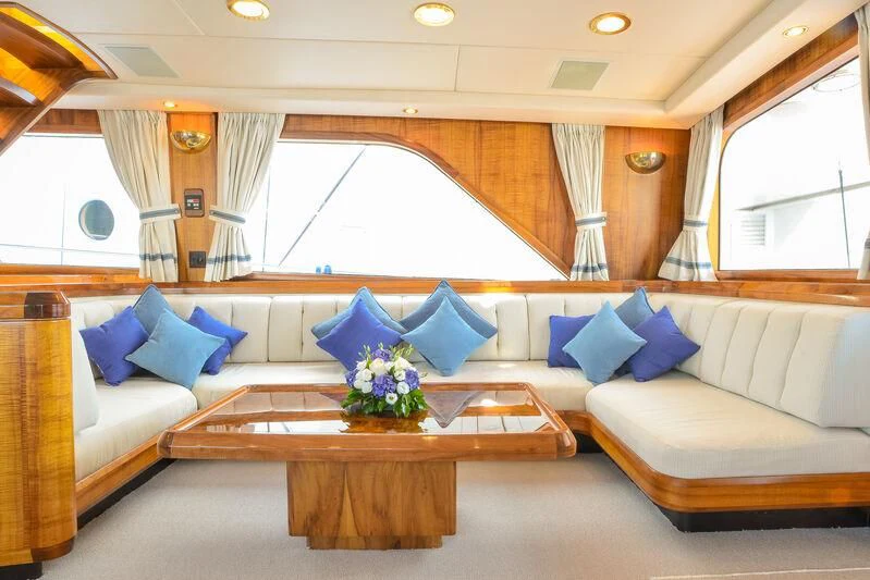 a large living room with a large window aboard GOLDEN OSPREY Yacht for Sale